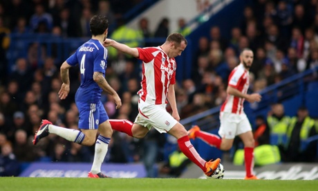 Charlie Adam unleashes his 65-yard wonder strike as Cesc Fàbregas watches on oblivious to the danger.