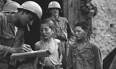US soldiers questioning North Korean boys during the Korean war in 1950. US soldiers questioning North Korean boys during the Korean war in 1950. The brainwashing of captured GIs led to research by social psychologists into resistance to persuasion.