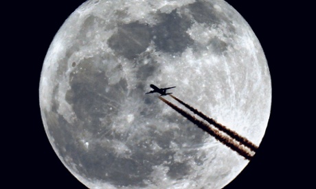 plane flying to the moon