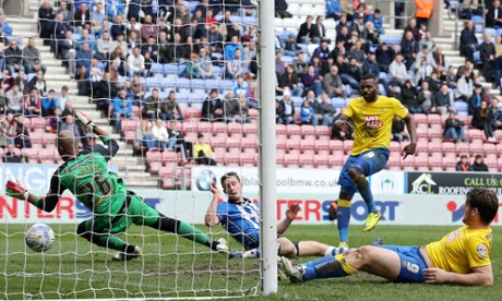 Darren Bent accepts a gift from Wigan's Jason Pearce to fire home the second for Derby.