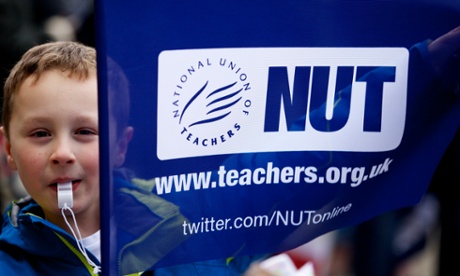 A boy carrying a flag for the National Union of Teachers during a strike in Bradford last year. The union has discussed ‘joint working’ with the ATL.
