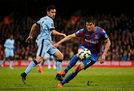 Manchester City's Jesus Navas battles for the ball with Martin Kelly.