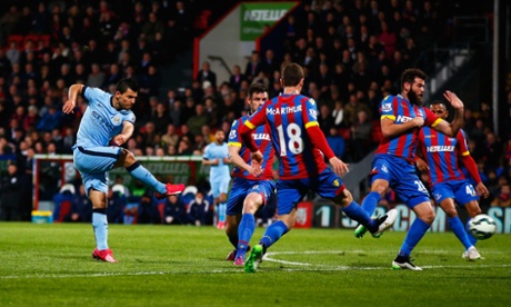 This effort by Sergio Aguero smacks the post.