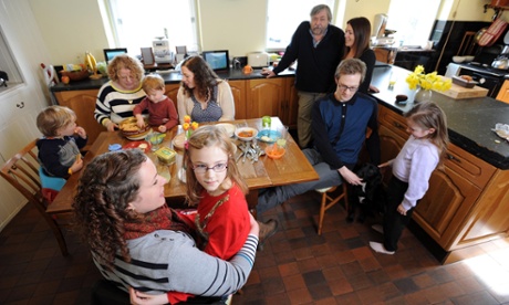 Anna Caig (foreground, with daughter Elsie), her mother Fiona and father Duncan, and other members of her family in the kitchen of Knowsley Farm.