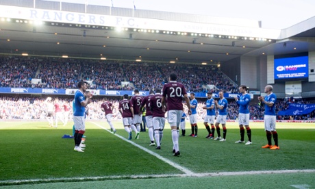Rangers players form a guard of honour for Hearts players at Ibrox.