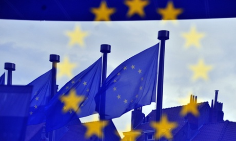 European flags reflected at the entrance of the Berlaymont building EU Commission in Brussels.