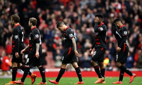 The Liverpool players trudge off the pitch after their diabolical performance.