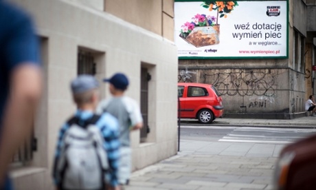 'Get a Grant, Replace your Furnace'. A post in Kraków tells householders how they could get financial support for the changeover from coal.