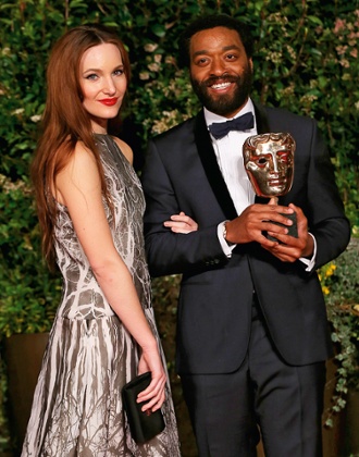 With girlfriend Sari Mercer, and his 2014 Bafta