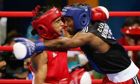 Lord of the ring: trading blows with Mario César Kindelán Mesa in the 2004 Olympic final.