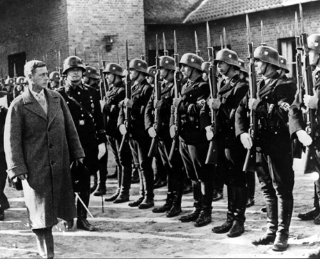 The Duke of Windsor inspecting a guard of honour at the Croessinsee Nazi training school, Germany, in 1937.