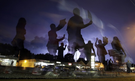 Protesters march through the streets of Ferguson in August.