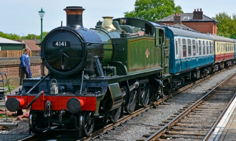 Ticket to ride: steam locomotive 4141 with train on the Epping Ongar heritage railway at North Weald station.