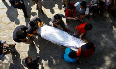 Family members carry the body of Ang Kaji Sherpa, who died in the Everest avalanche, at a monastery in Kathmandu, Nepal last April.