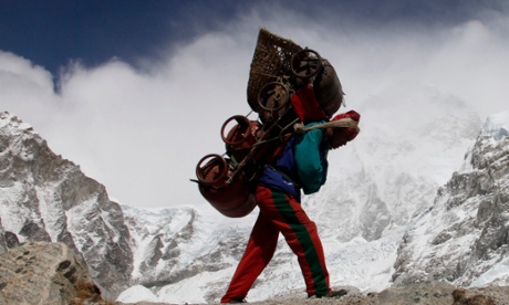 A Nepalese porter walks with his load from Everest base camp.