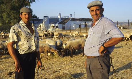 Two farmers tend their animals in the village of Zahara de la Sierra in the province of Cadiz, southern Spain.