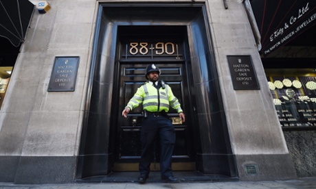 A police officer outside the Hatton Garden Safe Deposit company, the scene of the robbery.