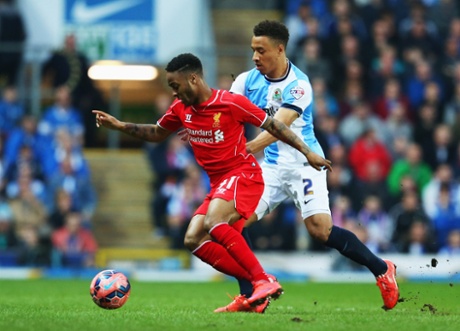 Raheem Sterling holds off Adam Henley.
