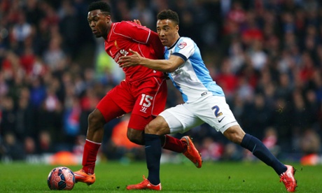 Daniel Sturridge of Liverpool and Adam Henley of Blackburn Rovers.