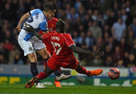 Craig Conway has ashot as Mamadou Sakho blocks.