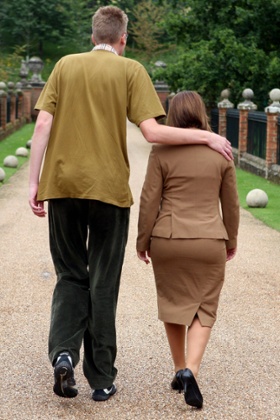 Carsten Mathiesen, a 7ft 1in member of the Tall Persons Club, walks with 5ft 4in organiser Bronwyn Hartney at the club's anniversary weekend.