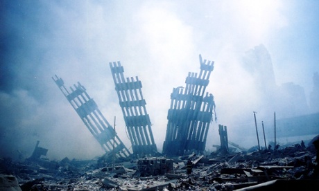 The rubble of the World Trade Centre smoulders after the terrorist attacks of 9/11, which are the subject of ENO’s world premiere production of Between Worlds.