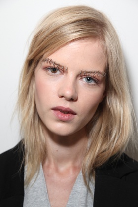 A model backstage at Rodarte spring 2015 show