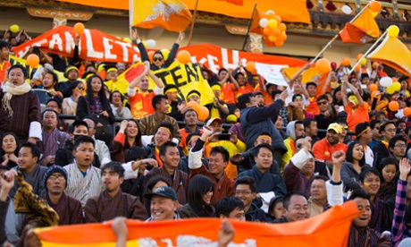 Bhutanese football fans watch the 2018 FIFA World Cup Preliminary Round qualifying match between Bhutan and Sri Lanka in Thimphu on March 17, 2015. 