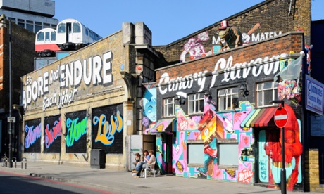 Graffiti and old tube trains on the outside of Village Underground, Shoreditch