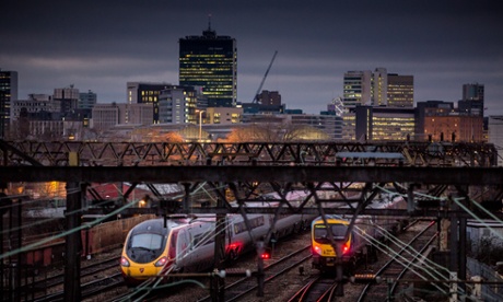 Trains leaving Manchester Piccadilly station.