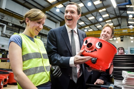 George Osborne admires his handy-work after putting together a Henry vacuum, in Exeter.