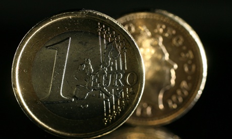 MANCHESTER, UNITED KINGDOM - OCTOBER 24:  In this photo illustration a one Euro coin can be seen next to a British one pound coin on October 23, 2008 in Manchester, England. As markets across the globe continue to struggle the world wide credit crunch begins to bite deeper with fears of economic recession  (Photo by Christopher Furlong/Getty Images)cashmoneyfinanceeconomynotecoinscoinrecessioncreditcredit crunchsavingsspend
