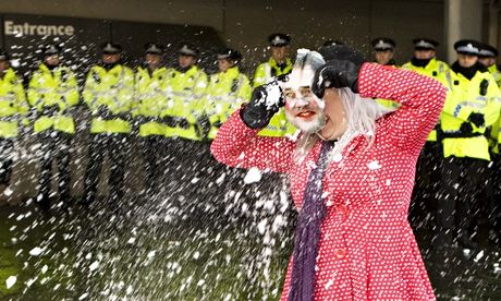 Protesting student wearing a Nick Clegg mask