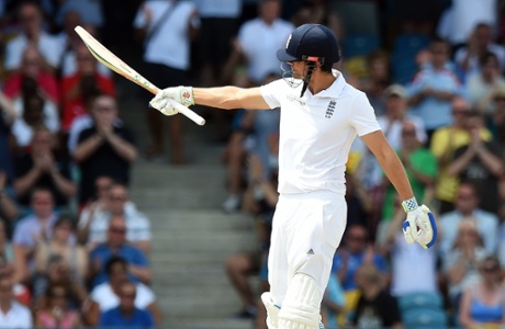 Alastair Cook lifts his bat after scoring another half-century, his sixth in his last nine innings.