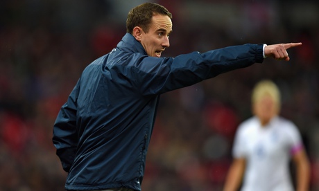England coach Mark Sampson directs players during last year's match against Germany at Wembley Stadi