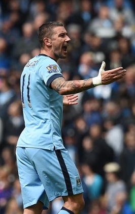 Kolarov celebrates his goal.