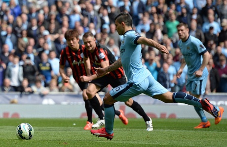 Sergio Aguero shoots to score his third goal from the penalty.