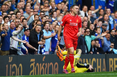 Rickie Lambert is haranged by the chelsea fans after colliding with Thibaut Courtois.