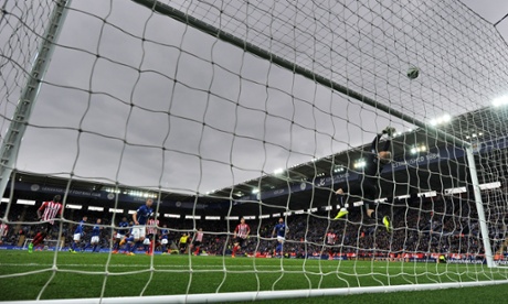 Leicester City's Danish goalkeeper Kasper Schmeichel makes a save against Everton.