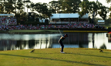 Kevin Kisner plays his shot from the 17th tee during a playoff.
