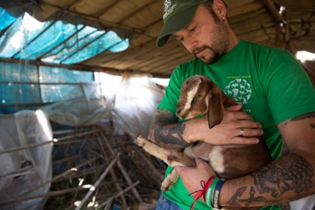 Adam Parascandola with an orphaned baby goat in Kalitaar, a small village outside Kathmandu that was severely damaged by the earthquake.