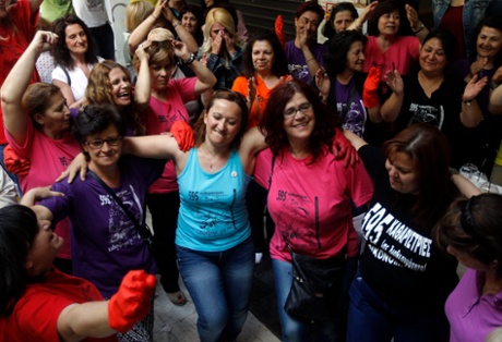 epa04742668 Cleaning personel of the Finance Ministry that had lost their jobs after acts by the previous government, dance in a celebration that took place at the spot where they had camp as a protest for the previous twenty months, outside the ministry, in Athens on 11 May 2015. Greek government decided last week to rehire the laid off ladies as a vindication of their long term struggle.  EPA/ORESTIS PANAGIOTOU