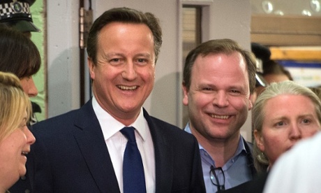David Cameron and his team including Craig Oliver (right) share a joke before receiving his constituency result in Witney