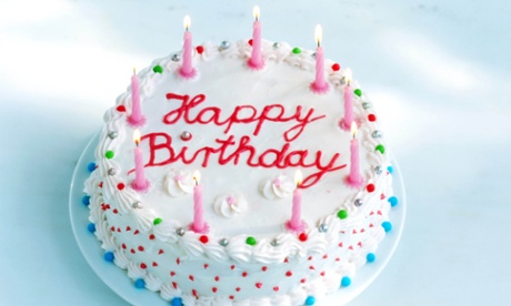 Birthday cake with candles lit.