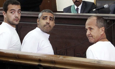 Al-Jazeera journalists appear in court along with several other defendants during their trial on terror charges, in Cairo, in January 2015.