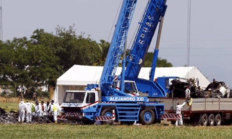 Investigators at the scene of the Airbus A400M crash in Seville.