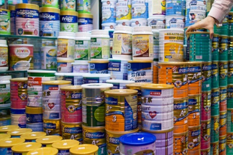 Cans of baby formula are displayed in a pharmacy in the Causeway Bay area of Hong Kong, China.