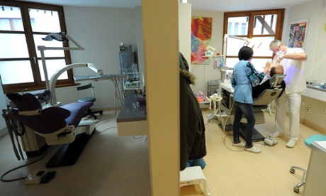 A patient gets dental treatment at a health centre in Budapest.