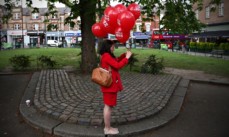 Labour activist with red balloons