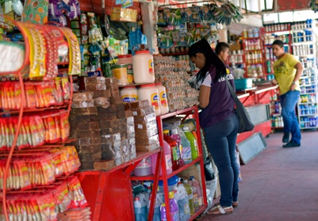 A shopper browses for items at Cenabastos market in Cúcuta, Colombia.